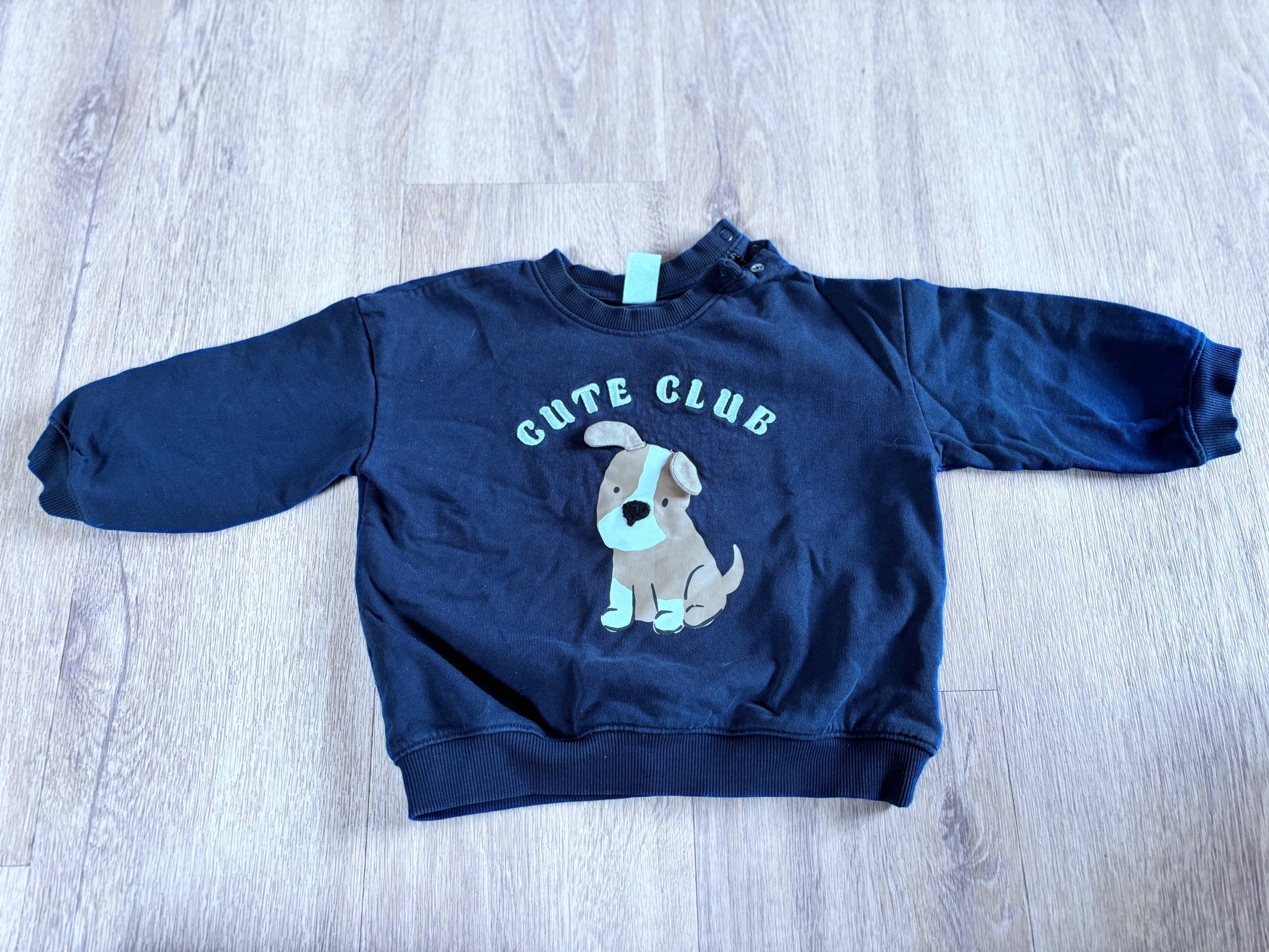 Temno moder pulover s potiskom